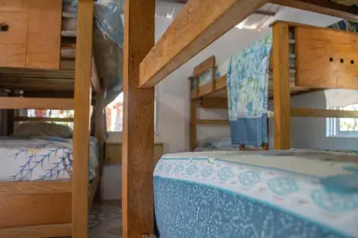 two bunk beds in a room with a bunk bed at L' Europe in Isla Fuerte