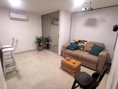 a living room with a couch and a table at Hermoso Apartamento Zona Norte Miramar # in Barranquilla