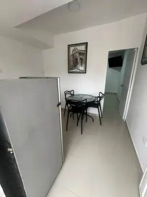 a room with a table and chairs in a room at Apartamento in Cartagena de Indias
