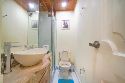 a bathroom with a white sink and a toilet at conjunto habitacional las bóvedas in Cartagena de Indias