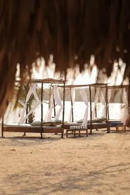 a row of benches with white bows on them at Club Camping Islamar in Baru