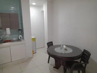 a kitchen with a table and chairs in a room at Apartaestudio Cartagena in Cartagena de Indias