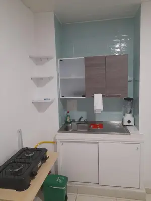 a small kitchen with a stove and a sink at Apartaestudio Cartagena in Cartagena de Indias