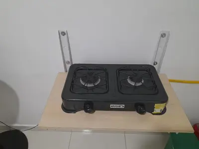a stove sitting on top of a wooden table at Apartaestudio Cartagena in Cartagena de Indias