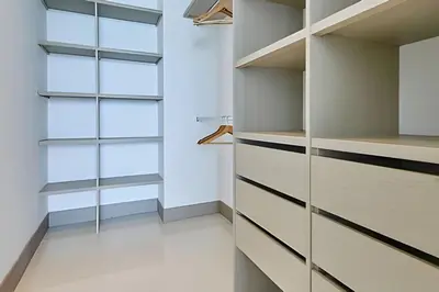 a walk in closet with glass shelves at Laurdhomes Palmetto Beach Sew View, Hot Water in Cartagena de Indias