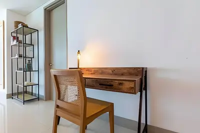 a wooden desk with a chair in a room at Laurdhomes Palmetto Beach Sew View, Hot Water in Cartagena de Indias