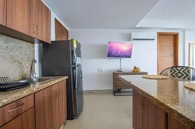a kitchen with a sink and a refrigerator at LaurdHomes Palmetto Sea View, 2Rooms 2BTH Hot Ware in Cartagena de Indias