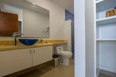 a bathroom with a sink and a toilet at LaurdHomes Palmetto Sea View, 2Rooms 2BTH Hot Ware in Cartagena de Indias
