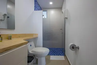 a bathroom with a toilet and a shower at LaurdHomes Palmetto Sea View, 2Rooms 2BTH Hot Ware in Cartagena de Indias
