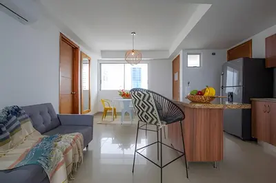 a kitchen and living room with a bar and a couch at LaurdHomes Palmetto Sea View, 2Rooms 2BTH Hot Ware in Cartagena de Indias