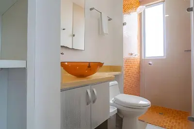a bathroom with a bowl sink and a toilet at LaurdHomes Palmetto Sea View, 2Rooms 2BTH Hot Ware in Cartagena de Indias