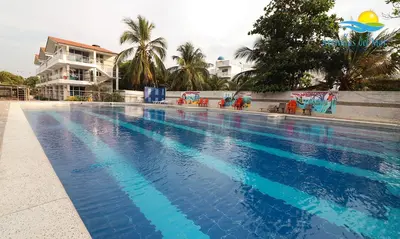 a large swimming pool with blue water at Arenillas del Mar in Tolú