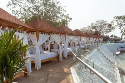 a row of beds on the patio of a resort at Bora Bora Beach Club Cartagena in Isla Grande