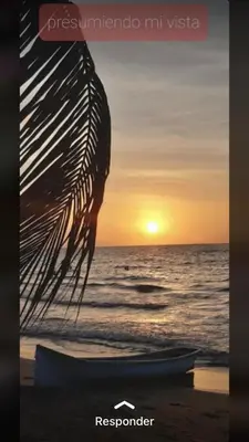 a picture of a sunset with a boat on the beach at Jamadis in Tolú