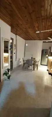 a large room with a table and chairs in it at Jamadis in Tolú