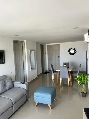 a living room with a couch and a table at Sunny House in Cartagena de Indias