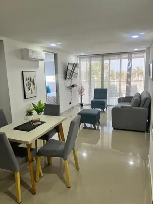 a living room with a table and chairs at Sunny House in Cartagena de Indias