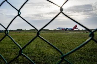 an airplane is taking off from an airport runway at ORESCA Hostel in Cartagena de Indias