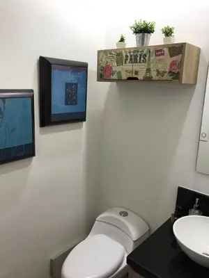 a bathroom with a toilet and a sink at Lujoso Apartamento en Bocagrande in Cartagena de Indias