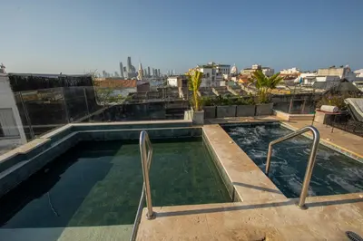 a swimming pool on the roof of a building at Hotel Voilá Centro Histórico in Cartagena de Indias