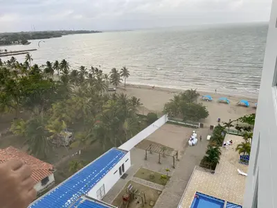 a view of the beach from the balcony of a resort at Apartamento con balcon y vista al mar en Coveñas in Coveñas