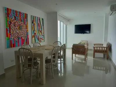 a dining room with a table and chairs at Apartamento con balcon y vista al mar en Coveñas in Coveñas