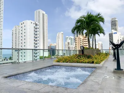 a balcony with a swimming pool on top of a building at Oceanview Escape Pool, Jacuzzi & Gym in Bocagrande in Cartagena de Indias