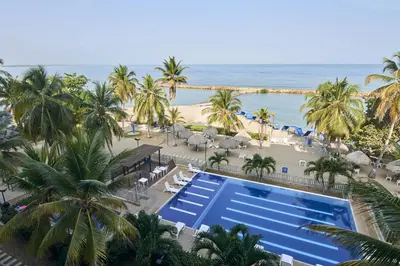 an aerial view of a resort with a pool and the beach at Magico Apartamento Frente al Mar 3 Habitaciones PAZ151 in Coveñitas