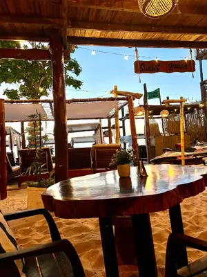 a wooden table sitting in the middle of a patio at SUNSET BEACH in Playa Blanca