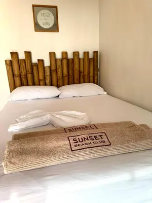 a bed with a wellness mat on top of it at SUNSET BEACH in Playa Blanca