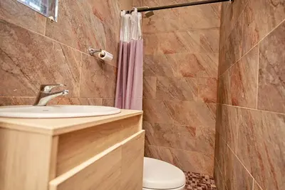 a bathroom with a sink and a toilet at Passarela Hospedaje in Cartagena de Indias