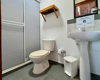 a bathroom with a toilet and a sink at Cabaña Coral Azul in Playa Blanca