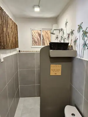 a bathroom with a toilet and a sink at Kite Eco House Salinas del rey in Salina de Rey