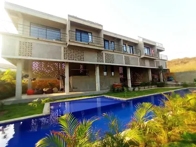 a house with a swimming pool in front of it at BREES in Santa Veronica