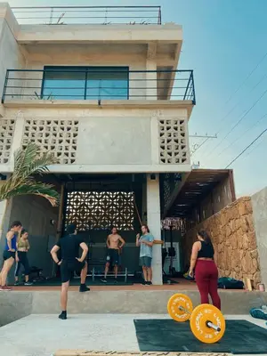 a group of people standing in front of a building at BREES in Santa Veronica