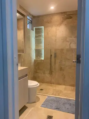 a bathroom with a toilet and a glass shower at Morros 3 - Vista y salida directa al mar in Cartagena de Indias