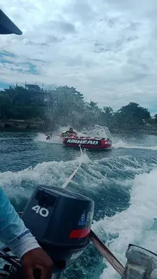 a person on a boat in the water at Hotel Paradise in Isla Fuerte