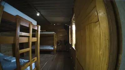 a hallway with two bunk beds in a cabin at Hotel Paradise in Isla Fuerte