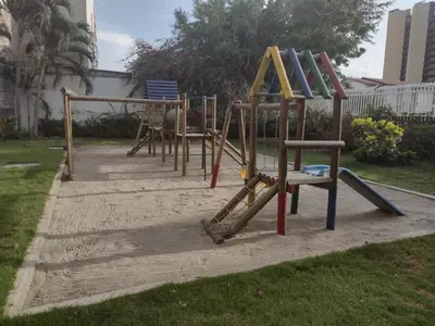 a row of playground equipment in a park at APARTAMENTO BELLO HORIZONTE in Santa Marta