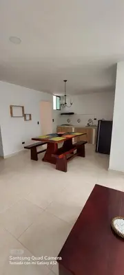 a living room with a table and a couch at Cabaña la Isla-Coveñas in Coveñas