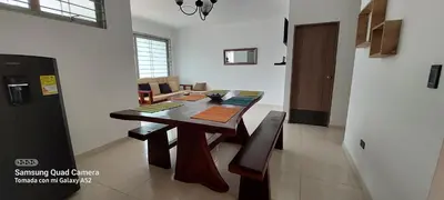 a dining room with a wooden table in a room at Cabaña la Isla-Coveñas in Coveñas