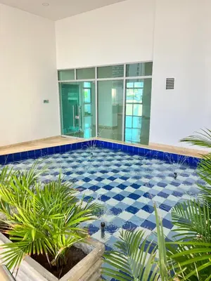 a large building with a blue and white tile floor at APTO DUPLEX Bella vista Piscina y buena ubicación in Cartagena de Indias