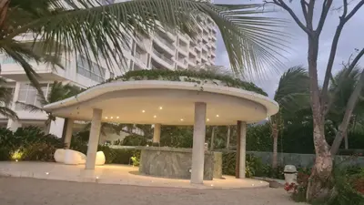 a round building with a plant on top of it at hermoso apartamento en pozos colorados con playa privada y doble vista al mar in Santa Marta