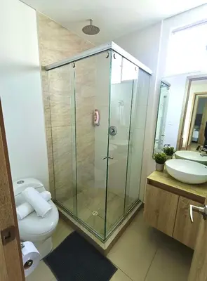 a bathroom with a shower and a toilet and a sink at New Apartments with great Sunsets near historic center and beach in Cartagena de Indias