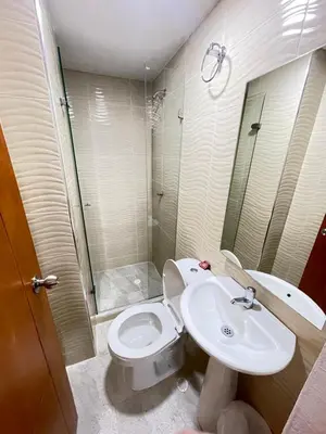 a bathroom with a toilet and a sink and a shower at Hotel La Yarolina SAS in Cartagena de Indias