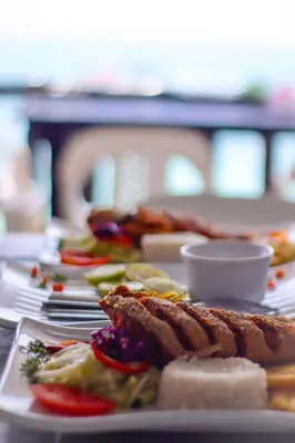 a row of plates of food on a table at Gafitas in Playa Blanca