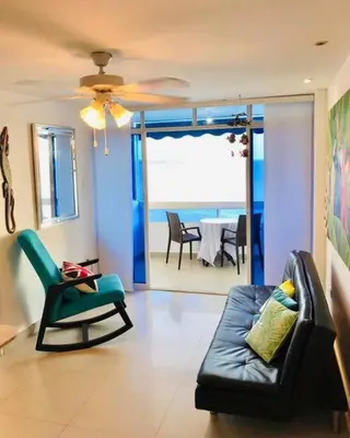 a living room with a couch and a chair at Hermoso apartamento con vista al mar in Cartagena de Indias