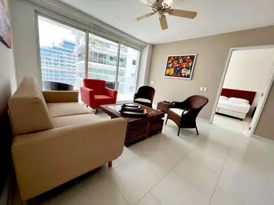 a living room with a couch and a table and chairs at Hermoso apartamento familiar /acceso directo a la playa. Morros 3 in Cartagena de Indias