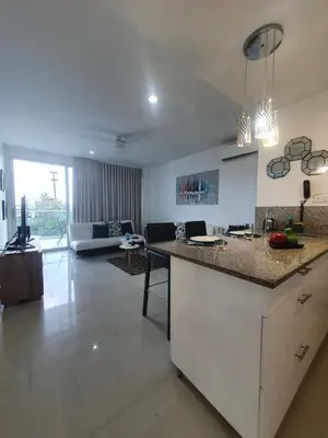 a kitchen and living room with a counter top at Espectacular apartamento Morros Epic Cartagena, Acceso directo a la playa in Cartagena de Indias