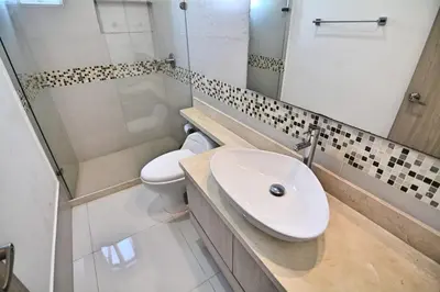 a bathroom with a sink and a toilet at Toscana Suite 2205 in Cartagena de Indias